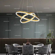 Lustra LED cu doua inele incrucisate aurii, 43W, 2000 lm, lumina reglabila 3000K-6400K, suspendata deasupra mesei de dining
