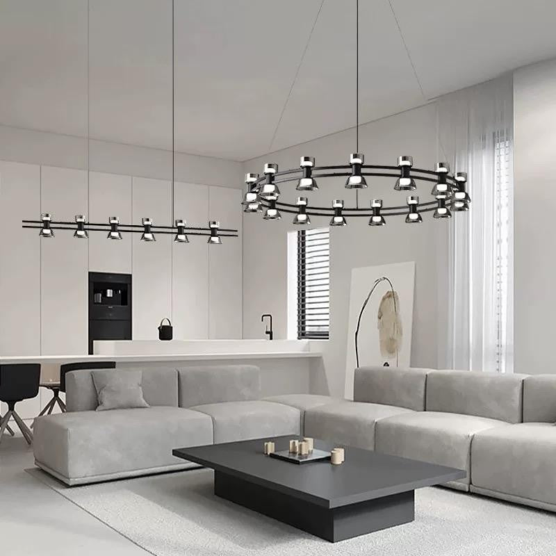 Lustra LED circulara neagra cu abajururi fumate, montaj suspendat in sufragerie open-space modern