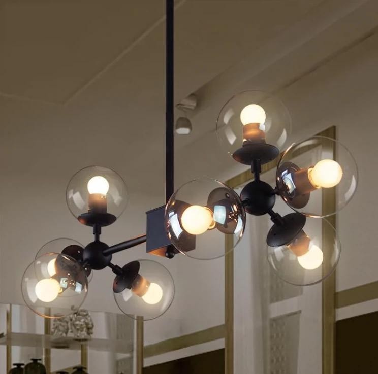 Lustra suspendata cu 8 globuri de sticla transparenta, structura metalica neagra mata, soclu E27, design molecular asimetric